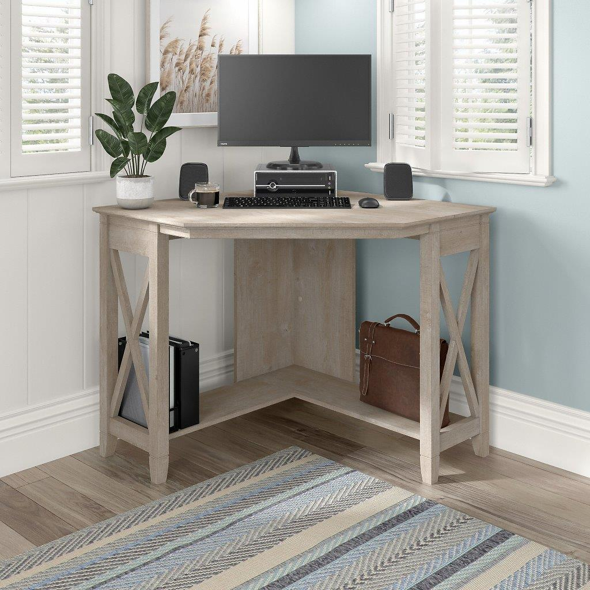 https://cdn.1stopbedrooms.com/media/catalog/product/b/u/bush-furniture-key-west-small-corner-desk-in-washed-gray_qb13408794.jpg