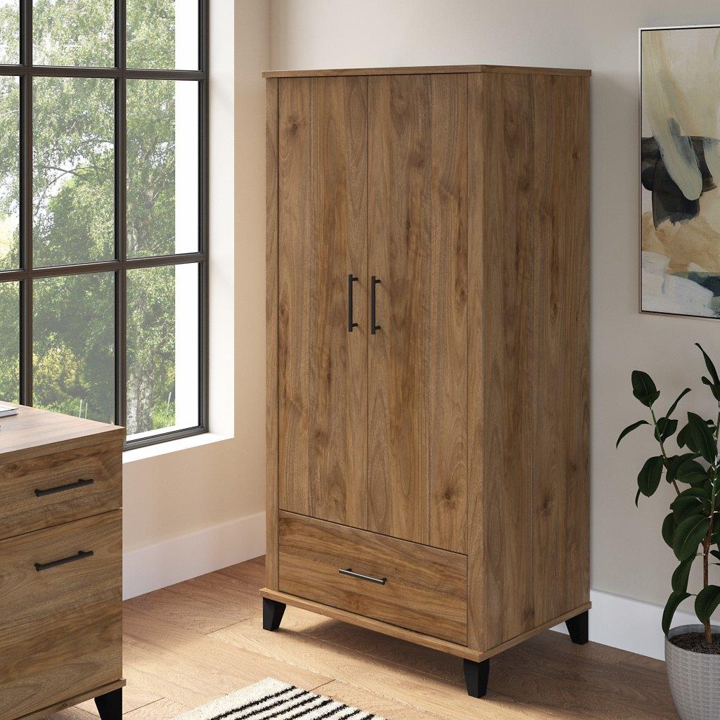 https://cdn.1stopbedrooms.com/media/catalog/product/b/u/bush-furniture-somerset-tall-storage-cabinet-with-doors-and-drawer-in-fresh-walnut_qb13364395.jpg