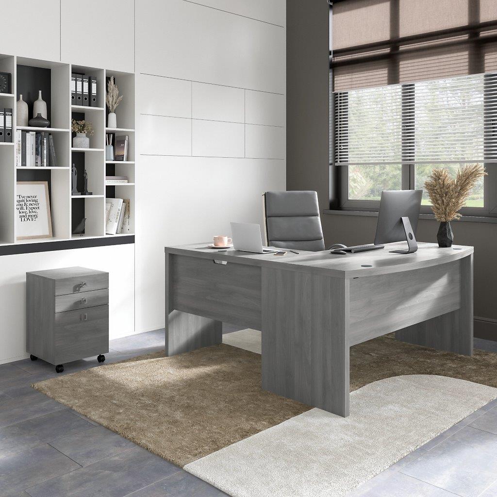 https://cdn.1stopbedrooms.com/media/catalog/product/o/f/office-by-kathy-ireland-echo-l-shaped-bow-front-desk-with-mobile-file-cabinet-in-modern-gray_qb13408151.jpg