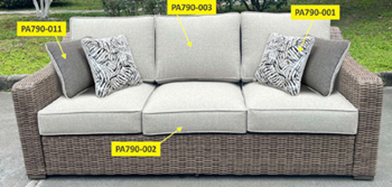 Revare Beach Back Cushion In Beige by Ashley Furniture | 1StopBedrooms