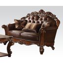 The appearance of Vendome Loveseat in Cherry designed by ACME in the rustic / southwestern interior design. This cherry piece of furniture was selected by 1StopBedrooms from Vendome Collection to add a touch of cosiness and style into your home. Sku: 52002. Material: Vinyl. Key Features: Tufted.