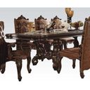 The appearance of Acme Versailles Pedestal Dining Table in Cherry Oak designed by ACME in the rustic / southwestern interior design. This brown piece of furniture was selected by 1StopBedrooms from Versailles Collection to add a touch of cosiness and style into your home. Sku: 61100T;61101ST. Material: Wood. Table Top Shape: Rectangular. Size: 46" x 120".
