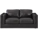 The appearance of Amiata Loveseat In Onyx designed by Signature Design by Ashley in the modern / contemporary interior design. This onyx piece of furniture was selected by 1StopBedrooms from Amiata Collection to add a touch of cosiness and style into your home. Sku: 5740535. Material: Leather Match.