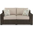 The appearance of Coastline Bay Outdoor Loveseat With Cushion In Brown designed by Signature Design by Ashley in the transitional interior design. This brown piece of furniture was selected by 1StopBedrooms from Coastline Bay Collection to add a touch of cosiness and style into your home. Sku: P784-835. Material: Fabric.