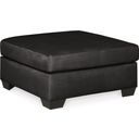 The appearance of Darcy Ottoman In Black designed by Signature Design by Ashley in the modern / contemporary interior design. This black piece of furniture  was selected by 1StopBedrooms from Darcy Collection to add a touch of cosiness and style into your home. Sku: 7500814. Material: Polyester.