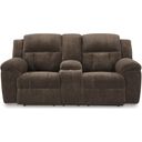 The appearance of Frohn Reclining Loveseat with Console In Chocolate designed by Signature Design by Ashley in the modern / contemporary interior design. This chocolate piece of furniture  was selected by 1StopBedrooms from Frohn Collection to add a touch of cosiness and style into your home. Sku: 3740794. Material: Fabric.