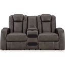 The appearance of Fyne-Dyme Power Reclining Loveseat with Console In Shadow designed by Signature Design by Ashley in the modern / contemporary interior design. This shadow piece of furniture  was selected by 1StopBedrooms from Fyne-Dyme Collection to add a touch of cosiness and style into your home. Sku: 3660218. Material: Faux Leather.