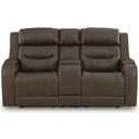 The appearance of Guru Power Reclining Loveseat with Audio Seating In Brown designed by Signature Design by Ashley in the modern / contemporary interior design. This brown piece of furniture was selected by 1StopBedrooms from Guru Collection to add a touch of cosiness and style into your home. Sku: NCU1160218A. Material: Leather Match.