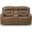 The appearance of Guru Power Reclining Loveseat with Audio Seating In Caramel designed by Signature Design by Ashley in the modern / contemporary interior design. This caramel piece of furniture  was selected by 1StopBedrooms from Guru Collection to add a touch of cosiness and style into your home. Sku: NCU1160018A. Material: Leather Match.