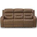 The appearance of Guru Power Reclining Sofa with Audio Seating In Caramel designed by Signature Design by Ashley in the modern / contemporary interior design. This caramel piece of furniture  was selected by 1StopBedrooms from Guru Collection to add a touch of cosiness and style into your home. Sku: NCU1160015A. Material: Leather Match.