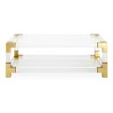 The appearance of Jacques Grand Cocktail Table In Brass and Clear Acrylic designed by Jonathan Adler in the modern / contemporary interior design. This brass and clear acrylic piece of furniture  was selected by 1StopBedrooms from Jacques Collection to add a touch of cosiness and style into your home. Sku: 26317. Material: Acrylic.
