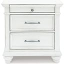The appearance of Kanwyn Whitewash Three Drawer Night Stand designed by Signature Design by Ashley in the transitional interior design. This white wash piece of furniture was selected by 1StopBedrooms from Kanwyn Collection to add a touch of cosiness and style into your home. Sku: B777-93. Material: Wood.
