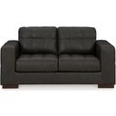 The appearance of Luigi Loveseat In Thunder designed by Signature Design by Ashley in the modern / contemporary interior design. This thunder piece of furniture was selected by 1StopBedrooms from Luigi Collection to add a touch of cosiness and style into your home. Sku: 5650635. Material: Faux Leather.
