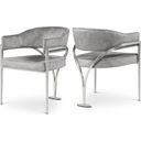 The appearance of Madelyn Velvet Dining Chair Set of 2 In Grey/Silver designed by Meridian in the modern / contemporary interior design. This grey piece of furniture  was selected by 1StopBedrooms from Madelyn Collection to add a touch of cosiness and style into your home. Sku: 554Grey-C. Material: Velvet.