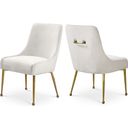 The appearance of Owen Velvet Dining Chair Set of 2 In Cream designed by Meridian in the modern / contemporary interior design. This cream velvet piece of furniture was selected by 1StopBedrooms from Owen Collection to add a touch of cosiness and style into your home. Sku: 744Cream. Material: Velvet.