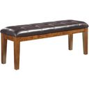 The appearance of Ralene Large Upholstered Dining Room Bench designed by Signature Design by Ashley in the transitional interior design. This medium brown piece of furniture was selected by 1StopBedrooms from Ralene Collection to add a touch of cosiness and style into your home. Sku: D594-00. Material: Leather Match.