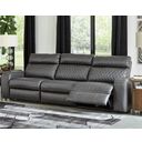 The appearance of Samperstone Power Reclining Sofa In Gray designed by Signature Design by Ashley in the modern / contemporary interior design. This gray piece of furniture  was selected by 1StopBedrooms from Samperstone Collection to add a touch of cosiness and style into your home. Sku: 5520346;5520362;5520358. Material: Faux Leather.