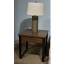 The appearance of Wickman Falls End Table In Dark Brown designed by Signature Design by Ashley in the modern / contemporary interior design. This dark brown piece of furniture was selected by 1StopBedrooms from Wickman Falls Collection to add a touch of cosiness and style into your home. Sku: T318-2. Material: Wood.