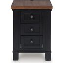The appearance of Wildenauer Chairside End Table In Brown and Black designed by Signature Design by Ashley in the transitional interior design. This brown/black piece of furniture was selected by 1StopBedrooms from Wildenauer Collection to add a touch of cosiness and style into your home. Sku: T664-7. Material: Wood.