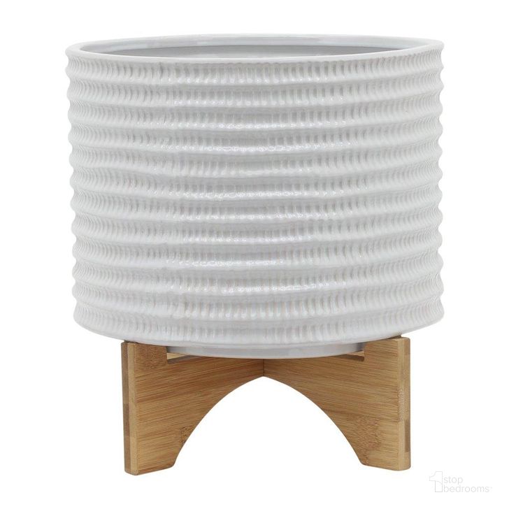 The appearance of 10 Inch Textured Planter With Stand In White designed by Sagebrook in the modern / contemporary interior design. This white piece of furniture  was selected by 1StopBedrooms from  to add a touch of cosiness and style into your home. Sku: 15780-01. Material: Ceramic. Product Type: Outdoor Accessory. Image1