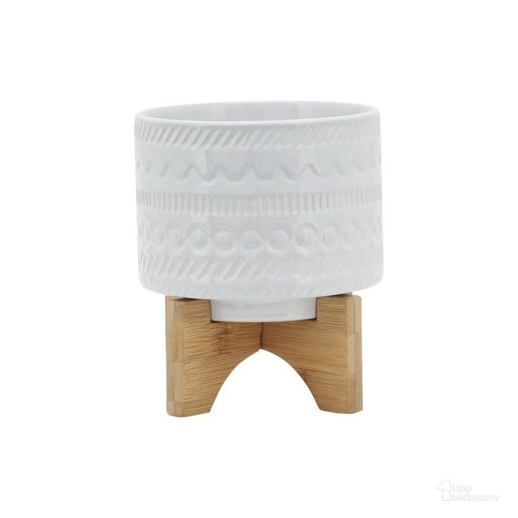 The appearance of 5 Inch Tribal Planter With Wood Stand In White designed by Sagebrook in the modern / contemporary interior design. This white piece of furniture  was selected by 1StopBedrooms from  to add a touch of cosiness and style into your home. Sku: 15350-04. Material: Ceramic. Product Type: Outdoor Accessory. Image1