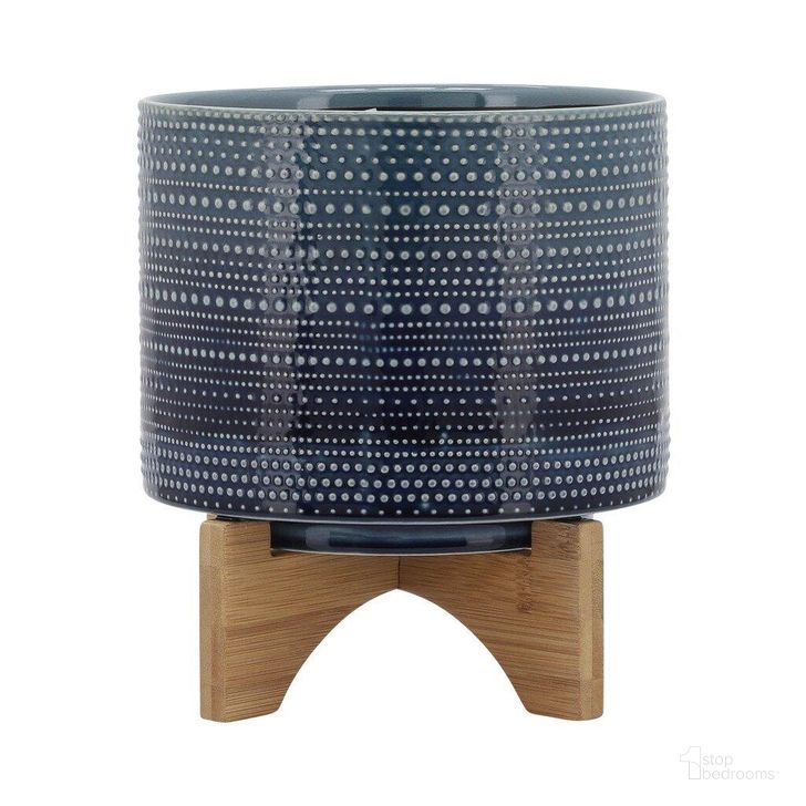The appearance of 8 Inch Dotted Planter With Wood Stand In Blue designed by Sagebrook in the modern / contemporary interior design. This blue piece of furniture  was selected by 1StopBedrooms from  to add a touch of cosiness and style into your home. Sku: 15348-02. Material: Ceramic. Product Type: Outdoor Accessory. Image1
