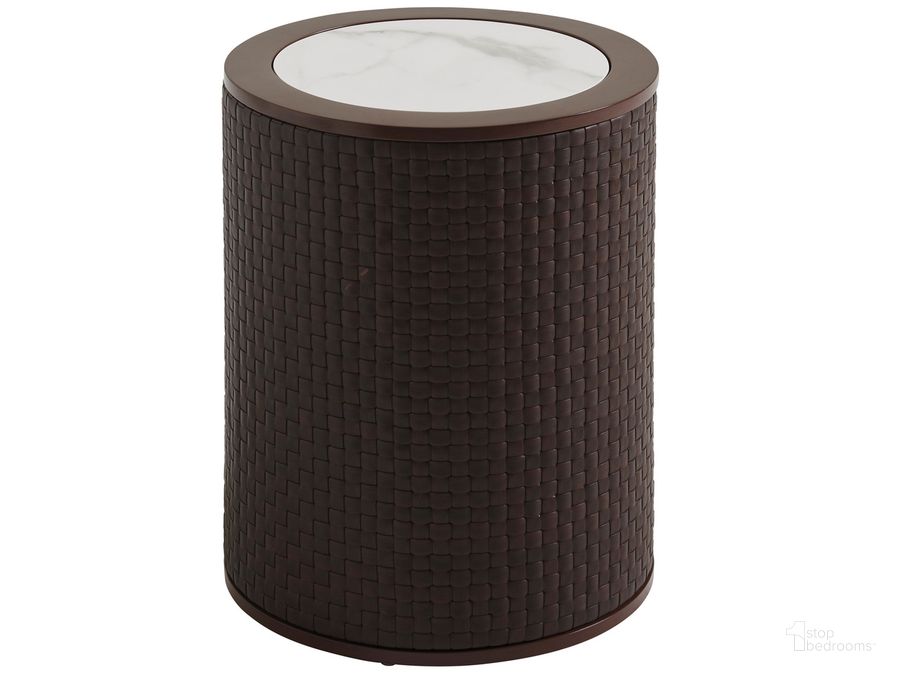 The appearance of Abaco Round Accent Table designed by Tommy Bahama in the transitional interior design. This medium brown piece of furniture  was selected by 1StopBedrooms from Abaco Collection to add a touch of cosiness and style into your home. Sku: 01-3420-952. Product Type: Outdoor Table. Image1