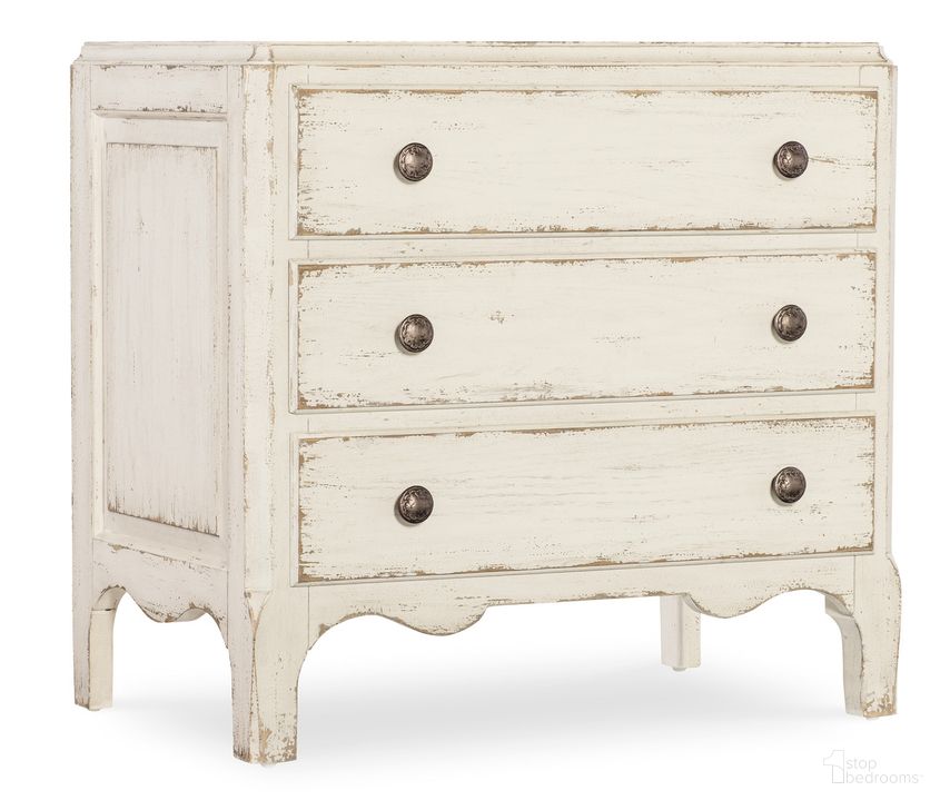 The appearance of Americana Three-Drawer Nightstand In White designed by Hooker in the transitional interior design. This white piece of furniture  was selected by 1StopBedrooms from Americana Collection to add a touch of cosiness and style into your home. Sku: 7050-90015-02. Product Type: Nightstand. Material: Wood Veneer. Image1