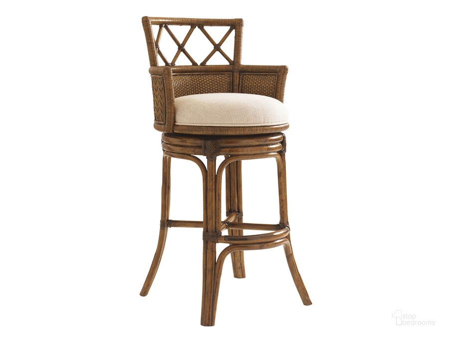 The appearance of Bali Hai Kamala Bay Swivel Barstool designed by Tommy Bahama in the transitional interior design. This brown piece of furniture  was selected by 1StopBedrooms from Bali Hai Collection to add a touch of cosiness and style into your home. Sku: 01-0593-816-01. Material: Rattan. Product Type: Barstool. Image1