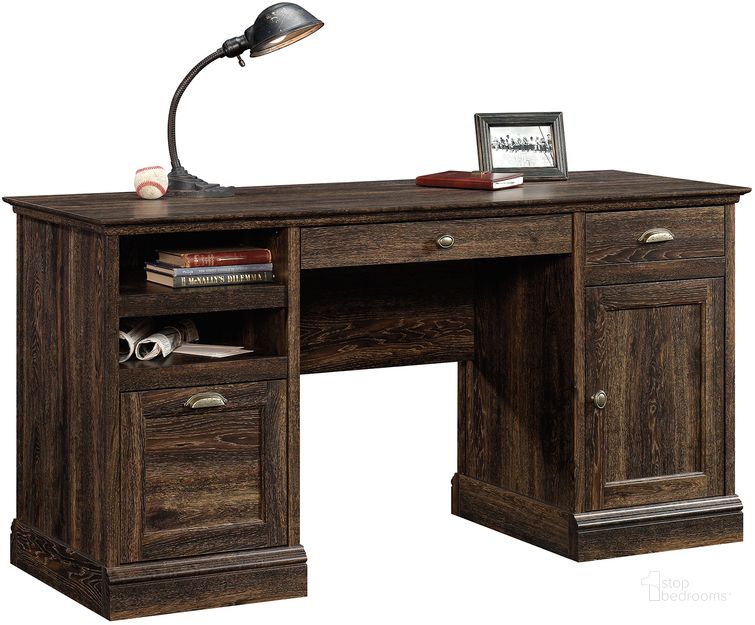 The appearance of Barrister Lane Executive Desk In Iron Oak designed by Sauder in the country / farmhouse interior design. This iron oak piece of furniture  was selected by 1StopBedrooms from Barrister Lane Collection to add a touch of cosiness and style into your home. Sku: 422706. Product Type: Executive Desk. Material: Engineered Wood. Image1