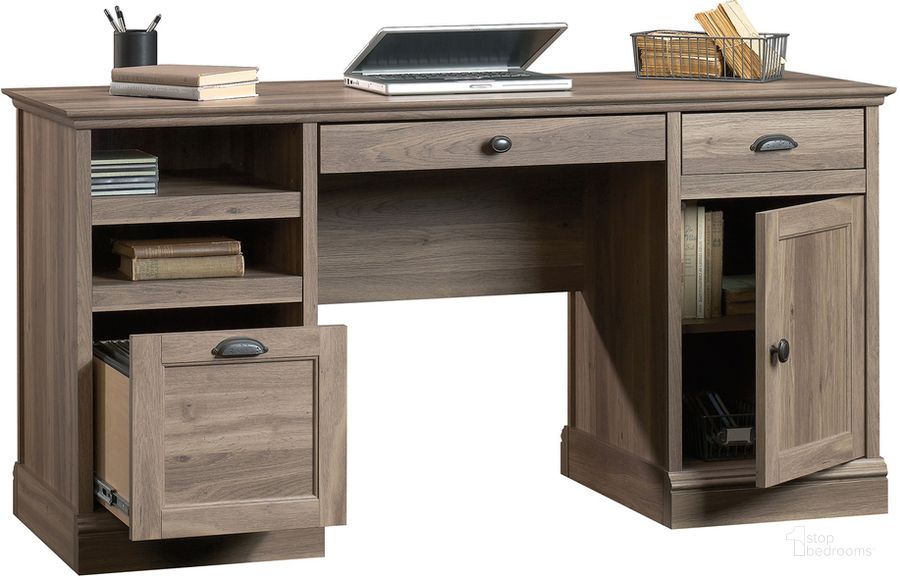 The appearance of Barrister Lane Executive Desk In Salt Oak designed by Sauder in the country / farmhouse interior design. This salt oak piece of furniture  was selected by 1StopBedrooms from Barrister Lane Collection to add a touch of cosiness and style into your home. Sku: 418299. Product Type: Executive Desk. Material: Engineered Wood. Image1