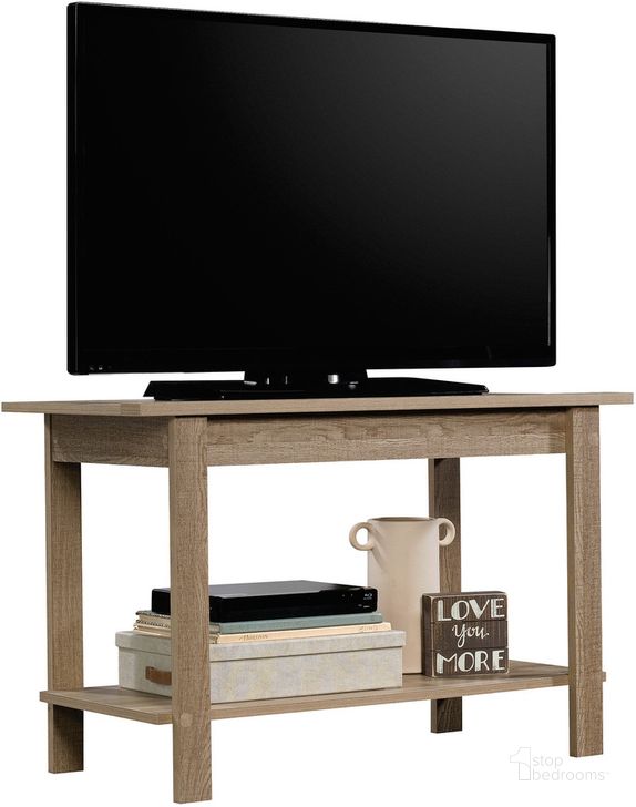 The appearance of Beginnings Tv Stand In Summer Oak designed by Sauder in the transitional interior design. This summer oak piece of furniture  was selected by 1StopBedrooms from Beginnings Collection to add a touch of cosiness and style into your home. Sku: 424255. Product Type: TV Stand. Material: Engineered Wood. Image1