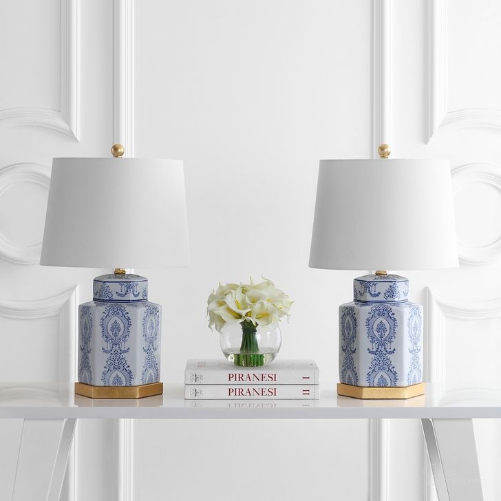 The appearance of Bodin Blue and White Table Lamp Set of 2 designed by Safavieh in the modern / contemporary interior design. This blue and white piece of furniture  was selected by 1StopBedrooms from Safavieh TBL Collection to add a touch of cosiness and style into your home. Sku: TBL4150A-SET2. Product Type: Table Lamp. Image1