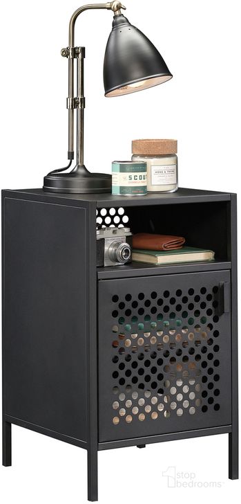 The appearance of Boulevard Cafe Night Stand In Black designed by Sauder in the modern / contemporary interior design. This black piece of furniture  was selected by 1StopBedrooms from Boulevard Cafe Collection to add a touch of cosiness and style into your home. Sku: 423268. Material: Metal. Product Type: Nightstand. Image1