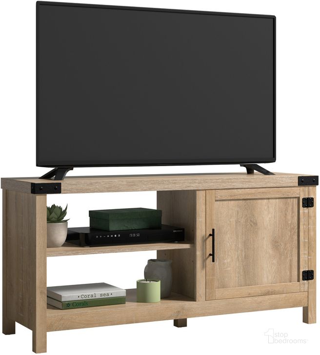 The appearance of Bridge Acre Tv Stand In Orchard Oak designed by Sauder in the country / farmhouse interior design. This orchard oak piece of furniture  was selected by 1StopBedrooms from Bridge Acre Collection to add a touch of cosiness and style into your home. Sku: 433726. Product Type: TV Stand. Material: Engineered Wood. Image1