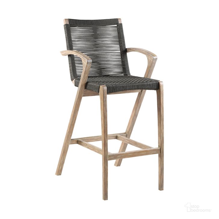 The appearance of Brielle Armed UV Protected Outdoor Light Eucalyptus Wood and Charcoal Rope Counter Height Stool with Footrest designed by Armen Living in the modern / contemporary interior design. This eucalyptus piece of furniture  was selected by 1StopBedrooms from Brielle Collection to add a touch of cosiness and style into your home. Sku: LCBLBACH26. Product Type: Outdoor Bar Furniture. Material: Rope. Image1