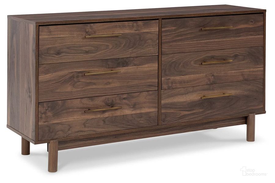 The appearance of Calverson Dresser In Mocha designed by Signature Design by Ashley in the transitional interior design. This mocha piece of furniture  was selected by 1StopBedrooms from Calverson Collection to add a touch of cosiness and style into your home. Sku: EB3660-131. Material: Wood. Product Type: Dresser. Image1