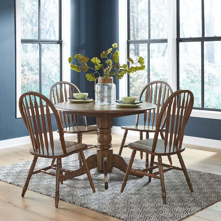 The appearance of Carolina Crossing Antique Honey Drop Leaf Extendable Dining Room Set designed by Liberty in the transitional interior design. This brown piece of furniture  was selected by 1StopBedrooms from Carolina Crossing Collection to add a touch of cosiness and style into your home. Sku: 186-P4242;186-T4242;186-C1000S. Product Type: Dining Room Set. Material: Rubberwood. Image1