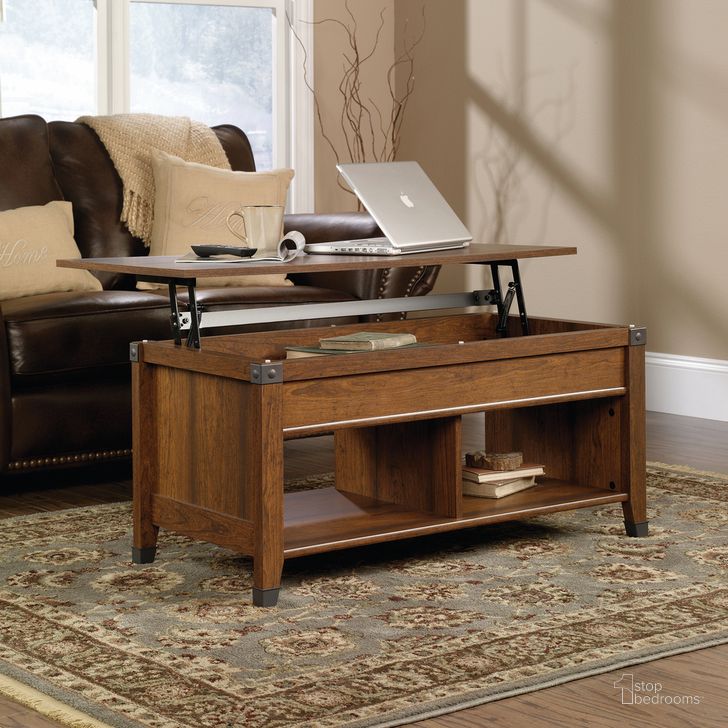 The appearance of Carson Forge Lift-Top Coffee Table In Washington Cherry designed by Sauder in the country / farmhouse interior design. This washington cherry piece of furniture  was selected by 1StopBedrooms from Carson Forge Collection to add a touch of cosiness and style into your home. Sku: 414444. Product Type: Coffee Table. Material: Engineered Wood. Image1