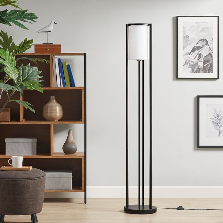 The appearance of Charlton Metal Floor Lamp with Glass Cylinder Shade In Black designed by Olliix in the modern / contemporary interior design. This black piece of furniture  was selected by 1StopBedrooms from Charlton Collection to add a touch of cosiness and style into your home. Sku: MT154-0065. Product Type: Floor Lamp. Material: Iron. Image1