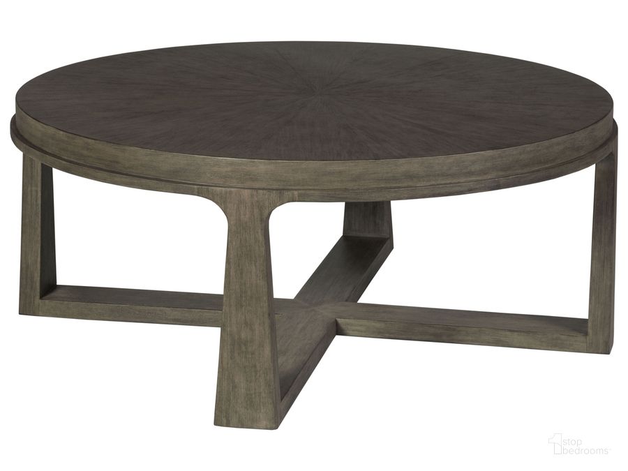 The appearance of Cohesion Program Rousseau Round Cocktail Table 01-2228-943-41 designed by Artistica Home in the modern / contemporary interior design. This warm gray piece of furniture  was selected by 1StopBedrooms from Cohesion Program Collection to add a touch of cosiness and style into your home. Sku: 01-2228-943-41. Product Type: Cocktail Table. Image1