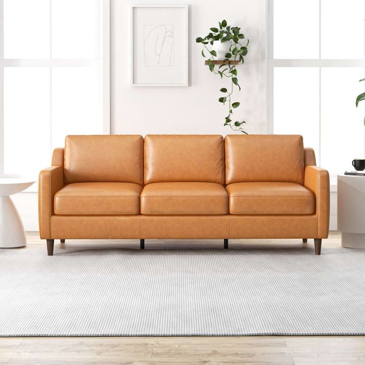 The appearance of Cooper Mid Century Modern Tan Leather Sofa designed by Ashcroft Furniture in the transitional interior design. This tan piece of furniture  was selected by 1StopBedrooms from Cooper Collection to add a touch of cosiness and style into your home. Sku: AFC00119. Material: Wood. Product Type: Sofa. Image1