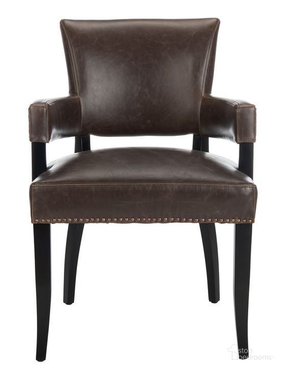 The appearance of Desa Antique Brown and Black Arm Chair with Brass Nailhead Detail designed by Safavieh in the transitional interior design. This antique brown piece of furniture  was selected by 1StopBedrooms from Desa Collection to add a touch of cosiness and style into your home. Sku: MCR4691A. Product Type: Dining Chair. Material: Stainless Steel. Image1
