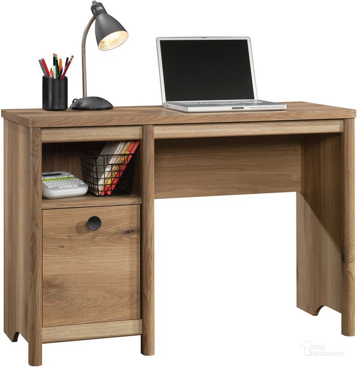 The appearance of Dover Edge Desk In Timber Oak designed by Sauder in the transitional interior design. This timber oak piece of furniture  was selected by 1StopBedrooms from Dover Edge Collection to add a touch of cosiness and style into your home. Sku: 433524. Product Type: Desk. Material: Engineered Wood. Image1