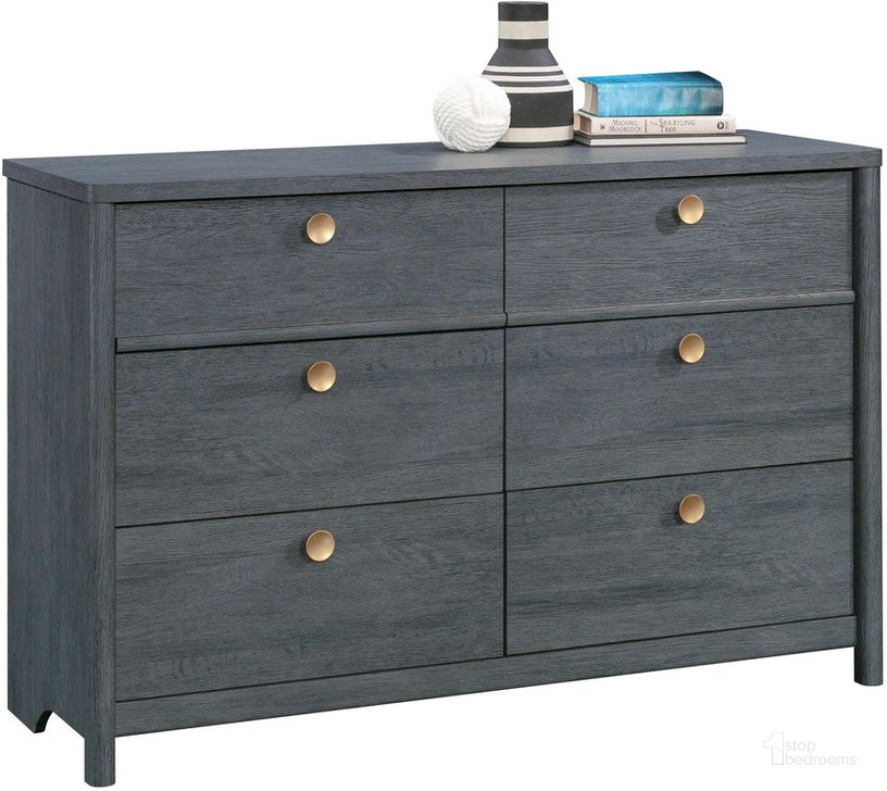 The appearance of Dover Edge Dresser In Denim Oak designed by Sauder in the transitional interior design. This denim oak piece of furniture  was selected by 1StopBedrooms from Dover Edge Collection to add a touch of cosiness and style into your home. Sku: 433518. Product Type: Dresser. Image1
