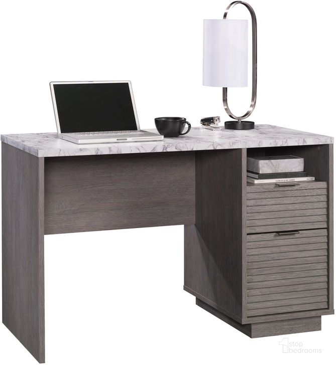 The appearance of East Rock Desk In Ashen Oak designed by Sauder in the transitional interior design. This ashen oak piece of furniture  was selected by 1StopBedrooms from East Rock Collection to add a touch of cosiness and style into your home. Sku: 431763. Product Type: Desk. Material: Engineered Wood. Image1