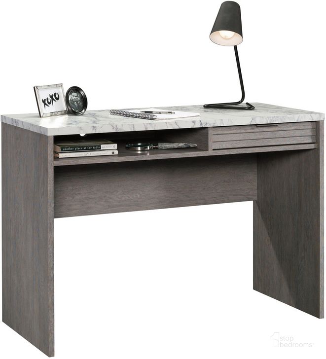 The appearance of East Rock Writing Desk In Ashen Oak designed by Sauder in the transitional interior design. This ashen oak piece of furniture  was selected by 1StopBedrooms from East Rock Collection to add a touch of cosiness and style into your home. Sku: 431757. Product Type: Writing Desk. Material: Engineered Wood. Image1