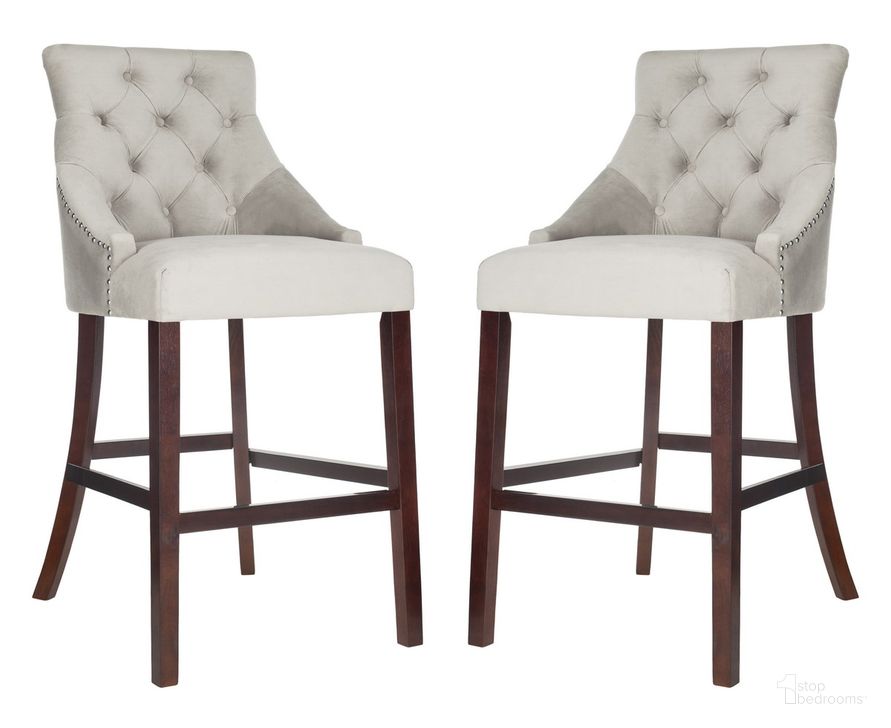 The appearance of Eleni Grey Tufted Wing Back Bar Stool Set of 2 designed by Safavieh in the modern / contemporary interior design. This gray piece of furniture  was selected by 1StopBedrooms from Eleni Collection to add a touch of cosiness and style into your home. Sku: BST6304B-SET2. Material: Wood. Product Type: Barstool. Image1