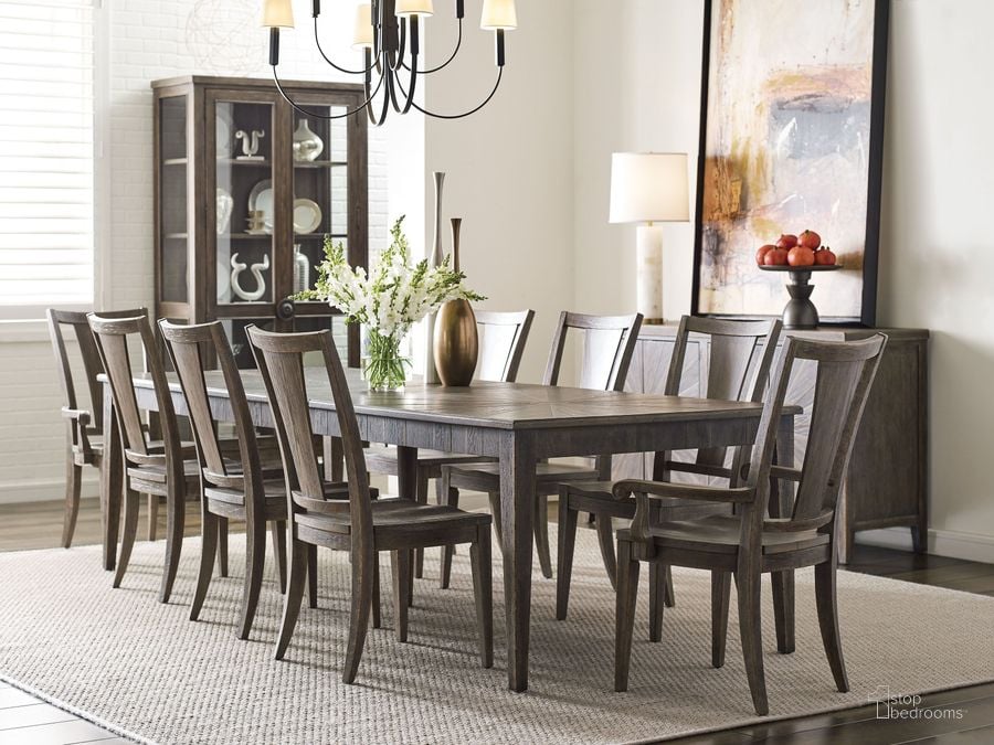 The appearance of Emporium Shadow Darrell Extendable Rectangular Dining Room Set designed by American Drew in the transitional interior design. This brown piece of furniture  was selected by 1StopBedrooms from Emporium Collection to add a touch of cosiness and style into your home. Sku: 012-744;012-636. Material: Wood. Product Type: Dining Room Set. Image1