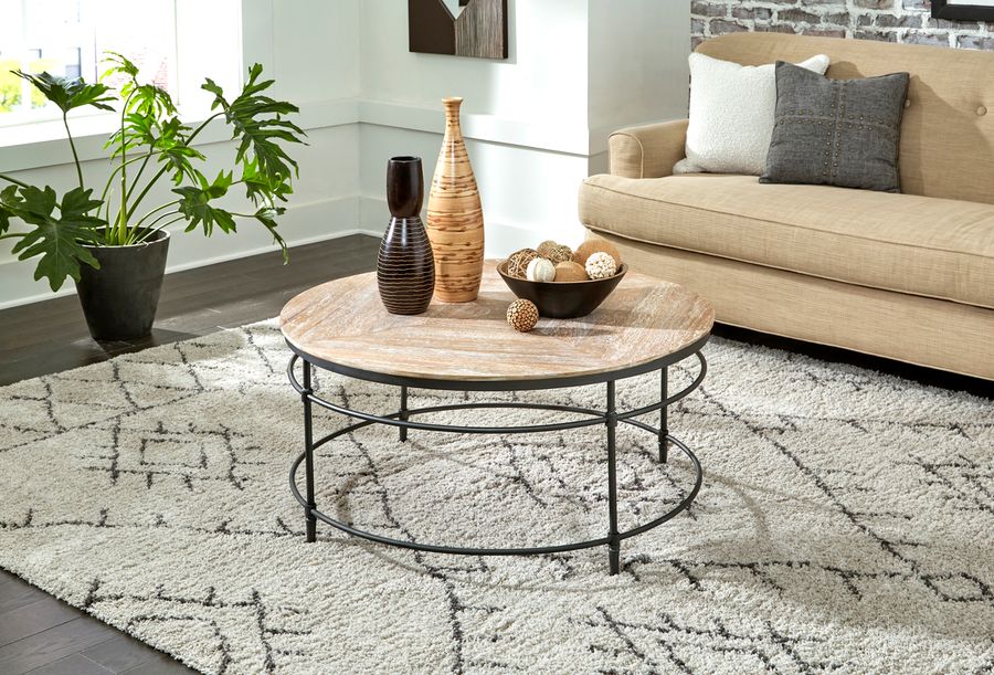 The appearance of Fenway 38 Inch Solid Wood and Metal Round Coffee Table In Pickled designed by Martin Svensson Home in the transitional interior design. This pickled piece of furniture  was selected by 1StopBedrooms from Fenway Collection to add a touch of cosiness and style into your home. Sku: 8714211. Material: Metal. Product Type: Coffee Table. Image1